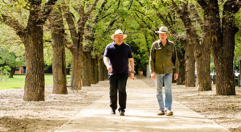 Men walking in park